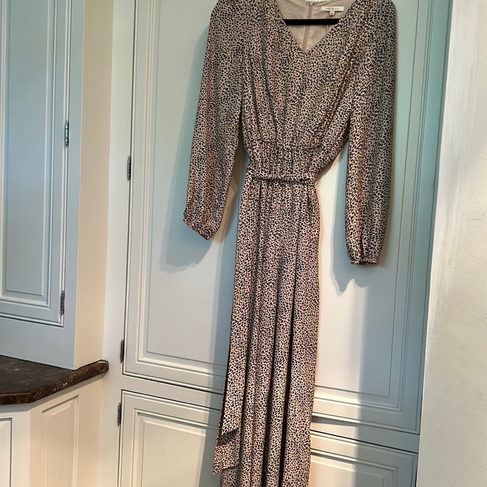 Woman’s animal print flowy long sleeve jumpsuit, black, and beige with tie belt